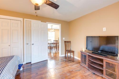 a living room with a large flat screen tv at Pet-Friendly Victoria Home - Kayak, Fish and Golf! in Victoria