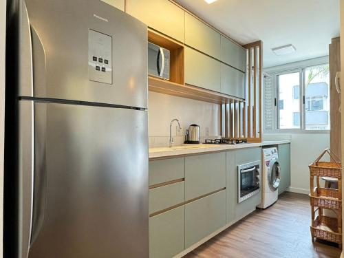 Una cocina o zona de cocina en Apartamento no Jurerê Open Shopping - NDI007