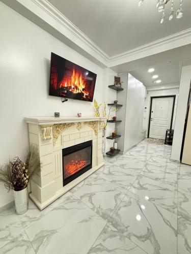 TV a/nebo společenská místnost v ubytování White Apartment