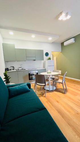 a living room with a couch and a table at Leila's home forever - casa vacanze in Bergamo
