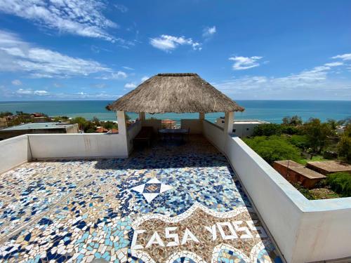 a resort with a tile floor and a gazebo at Casa Yoss in Toubab Dialaw
