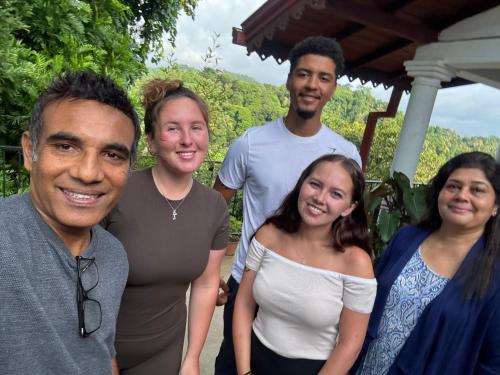 a group of people posing for a picture at Hideaway Homestay kandy in Haloluwa