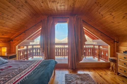 Ένα ή περισσότερα κρεβάτια σε δωμάτιο στο Les Chalets de Celine
