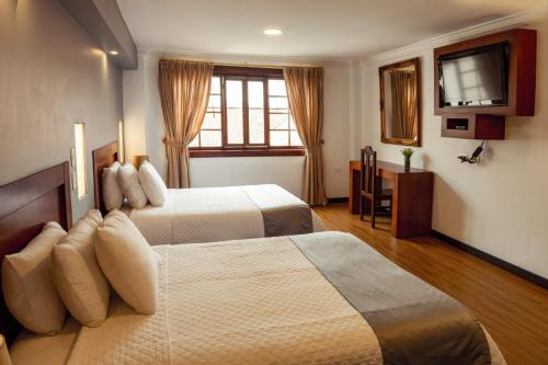 Kama o mga kama sa kuwarto sa SÁ Hotel