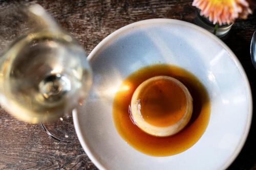 a cup of tea on a plate on a table at The Crown, Bildeston in Bildeston