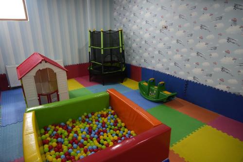 a childs play room with a pool of balls at Snowflake Dag Hotel & SPA in Sarıkamıs