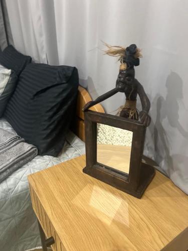 a statue sitting on top of a table at Vukmanović apartmani in Kikinda