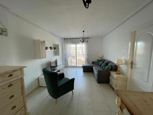 Posezení v ubytování Ground floor apartment with 3 pools