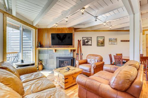 a living room with leather furniture and a fireplace at Mtn-View Condo with Community Perks in Silverthorne in Silverthorne