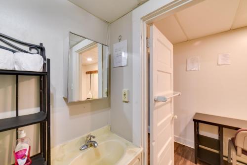 a bathroom with a sink and a mirror at South Dakota Hideaway Walk to Dtwn Redfield in Redfield