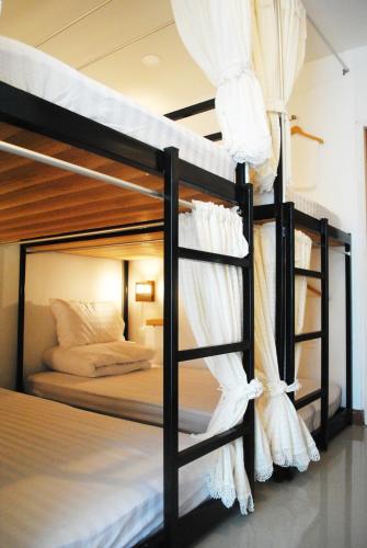 Postelja oz. postelje v sobi nastanitve Rimnim Hostel