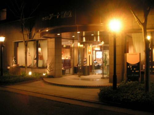 a street light in front of a building at night at Terminal Art Inn - Vacation STAY 66148v in Niigata