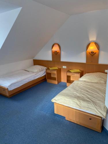 Postel nebo postele na pokoji v ubytování Hotel Stiegler