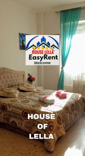 Ένα ή περισσότερα κρεβάτια σε δωμάτιο στο "HOUSE OF LELLA" Appartamento 2 Camere da letto