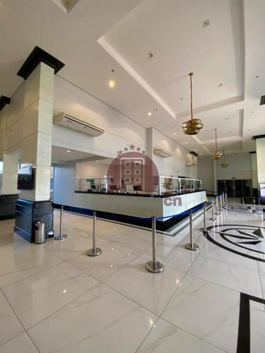 a lobby with a check in counter in a building at Piazza com acesso ao Acqua Park - Temporada CN Adriele in Caldas Novas