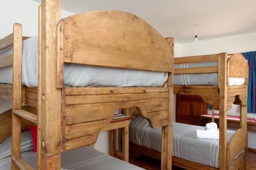 a couple of bunk beds in a room at troje tradicional purépecha -live the experince- in Morelia
