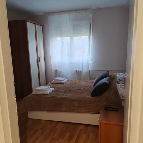 Postel nebo postele na pokoji v ubytování Apartman N&S