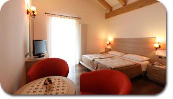 Кровать или кровати в номере Hotel Primula