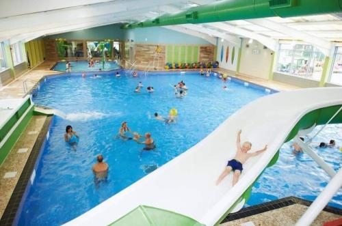 a group of people in a swimming pool at Doc's Cave in Mablethorpe