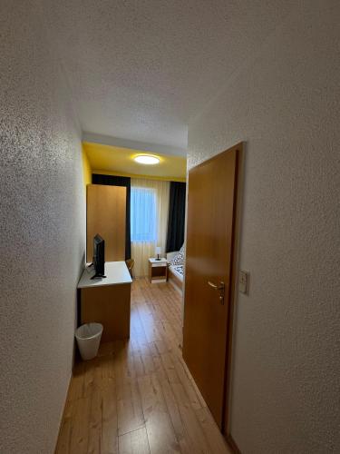 a room with a bathroom with a room with a toilet at Moonlight Hotel in Meiningen