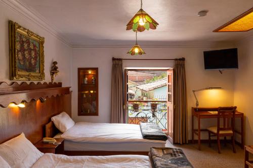 Voodi või voodid majutusasutuse Hotel La Posada de Atahualpa toas