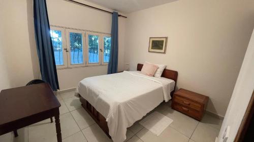 Ένα ή περισσότερα κρεβάτια σε δωμάτιο στο Villa Mila