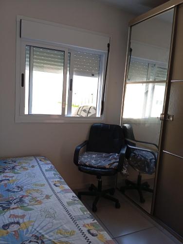 En eller flere senge i et værelse på Apartamento Terreo