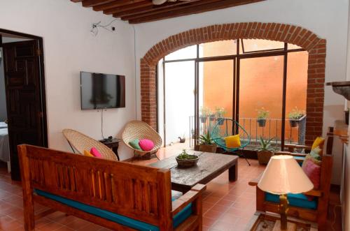 a living room with a couch and a table at Casa MORELOS Morelia Mich Centro historico in Morelia