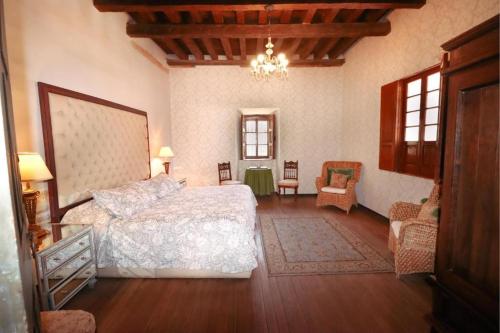 Hotel Boutique Mesón de la Abundanciaにあるベッド