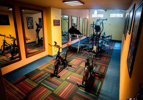 a gym with bikes and exercise bikes in a room at Hotel Parque Satelite in Mexico City