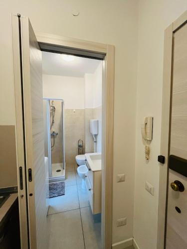 a bathroom with a toilet and a sink at Valtellina Sondrio Holidays 3 in Sondrio
