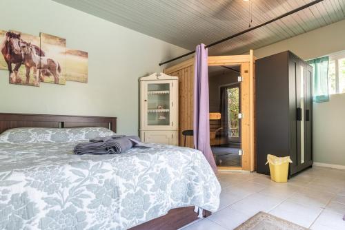 a bedroom with a bed and a sliding glass door at Pool Room - Entire Guest Suite - Private Entrance in San Diego