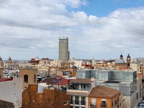 a view of a city with a tall building at Mediterranean Loft in Alicante