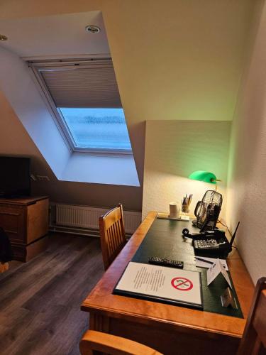 a room with a desk with a computer on it at Best Western Hotel Apollo in Oulu
