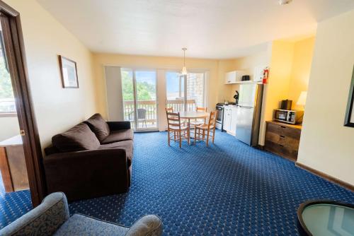 a living room with a couch and a table at Aspinquid Resort in Ogunquit