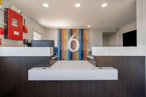 an office with a desk with a number six sign at Motel 6 Fort Worth, TX East in Fort Worth