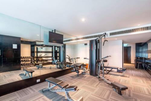 a gym with several treadmills and cardio machines at Svelte Delhi, a member of Radisson Individuals in New Delhi