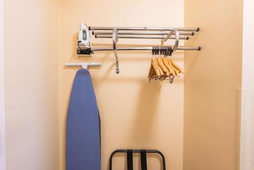 a blue tie is hanging on a rack at Fireside Inn & Suites Portland in Portland