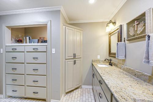 a bathroom with a sink and a mirror at Del Rio Home with Large Yard, BBQ and Fireplace! in Del Rio