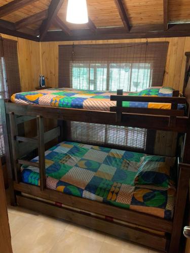 a couple of bunk beds in a room at El Barranquero in Cali