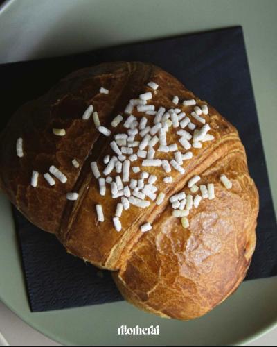 a loaf of bread with sesame seeds on it at Maison Comì in Frattamaggiore