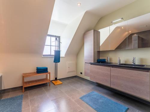 a kitchen with a sink and a counter top at Villa Meersen in Maldegem