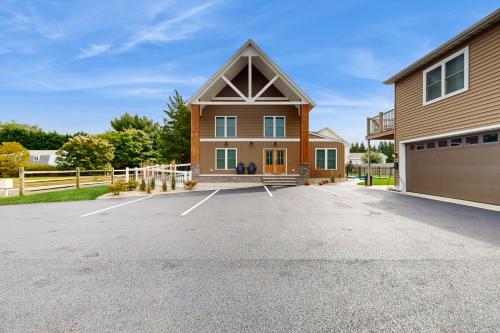 a house with a parking lot in front of it at Rehoboth Beach --- 35526 Dry Brook Drive Unit A in Rehoboth Beach