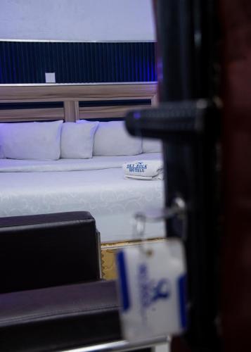 a couple of beds in a room with at Skyrock Hotels Ikeja in Ikeja