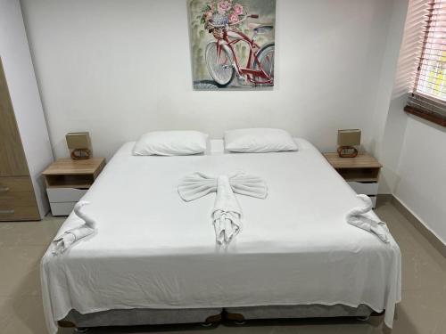 a bed with a drawing of a cow on it at Hotel Orduz Centro Histórico de Cali in Cali