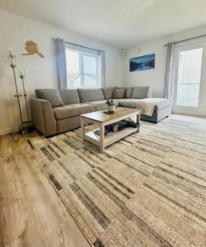 a living room with a couch and a coffee table at Easystay in Fairbanks