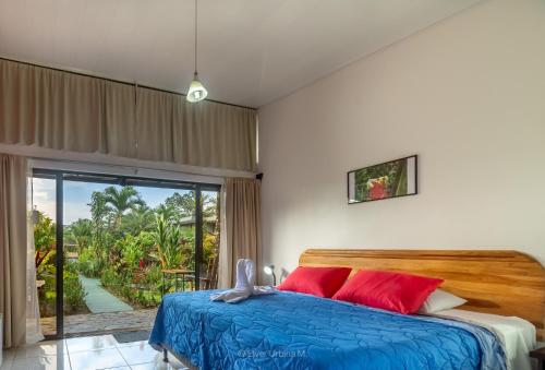 Postel nebo postele na pokoji v ubytování Hotel Secreto La Fortuna