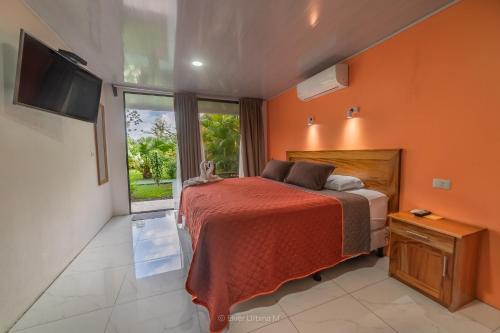 Postel nebo postele na pokoji v ubytování Hotel Secreto La Fortuna