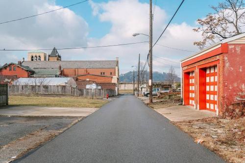 an empty street in a town with a red building at Parking Comfortable Suite in Pittsburgh