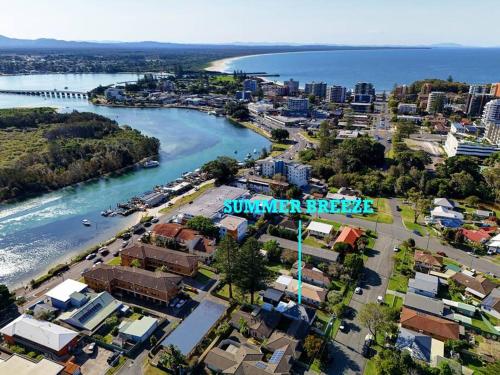 an aerial view of a city next to a river at Summer Breeze Forster in Forster